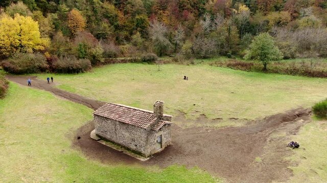 The Santa Margarida volcano with a hermitage in the centre of its crater. La Garrotxa Volcanic Zone Natural Park is a curious environment that overlooks part of the province of Girona.