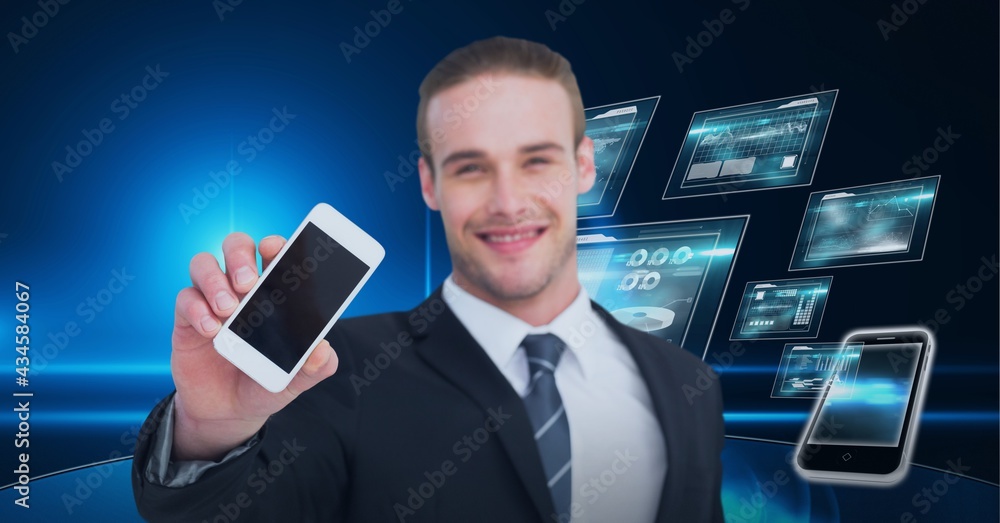 Poster composition of smiling businessman showing smartphone over digital screens with data processing