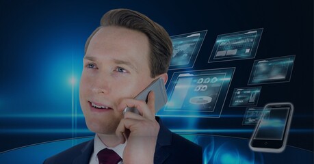 Composition of businessman talking on smartphone over digital screens with data processing