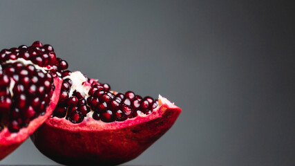 Pomegranate fruit and seeds close-up. 
