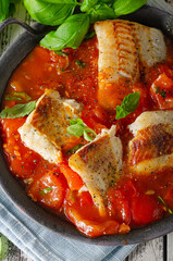 Delicious grilled fish with tomato sauce - 434584441