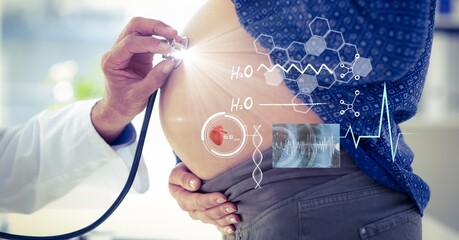 Composition of male doctor touching pregnant woman belly with screen with medical data processing - Powered by Adobe