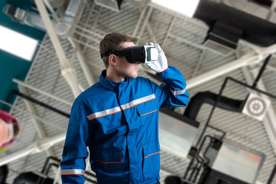 male worker in uniform using virtual reality glasses, new technology glasses