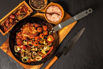 Meat, Pork neck in marinade and on a steel pan. Pork neck with baked potatoes and vegetables with chili.