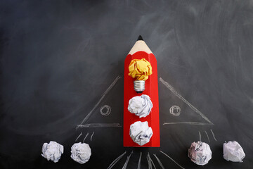 Education concept image. Creative idea and innovation. Crumpled paper as light bulb metaphor and...