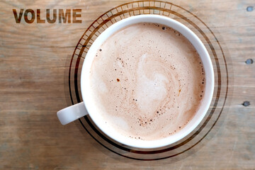 Cappuccino coffee in white cup on an old natural wooden table, concept volume, morning coffee, caffeine addiction, energy boost