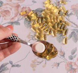 lat lay with pills on white background with flowers