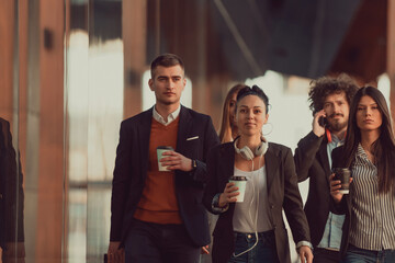 Elegant businesspeople walking in a modern city..