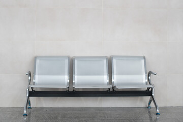 Empty metal benches in waiting room