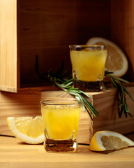Limoncello on a wooden table.