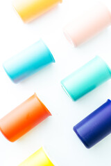 Colored bowl and object, pantone, colored items diplayed on a white background, top view, flatlay, wallpaper type advertisement style.