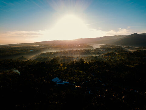 Aerial drone view of the foggy misty morning in Bali, Indonesia