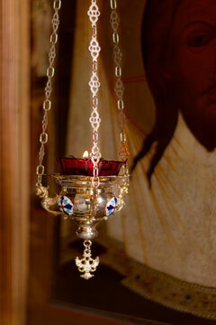 Icon lamp in front of icon in Orthodox Church. Indoors, day light Front view.