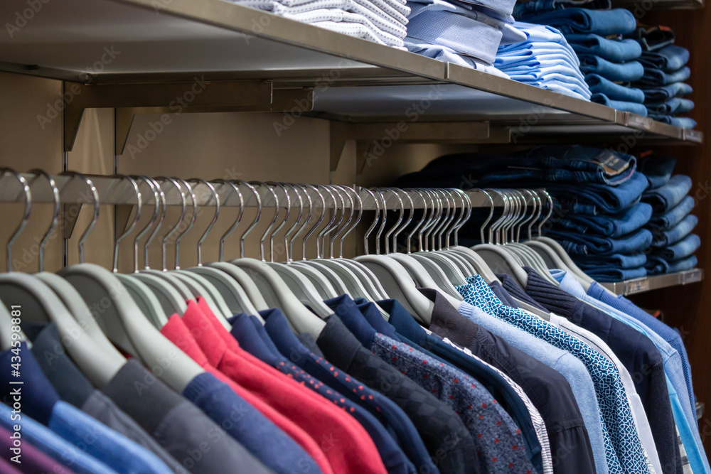 Wall mural Men's clothing on the shop windows. A set of men's clothing, shirt, tie, trousers.