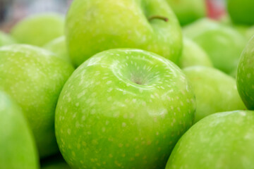 Photo on the theme of fruit. Boxes of juicy apples in the supermarket.