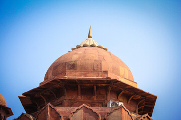 India travel tourism background - Red Fort (Lal Qila) Delhi - World Heritage Site. Inside view of the Red Fort, ancient tower of red stone in the fortress the dom