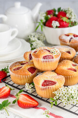 Homemade strawberry muffins or cupcakes. Culinary bakery concept.  Fruit  summer baking. Selective focus