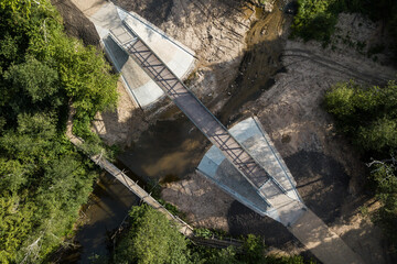 Aerial view of two bridges over Riezupe river, Mezvalde, Latvia.