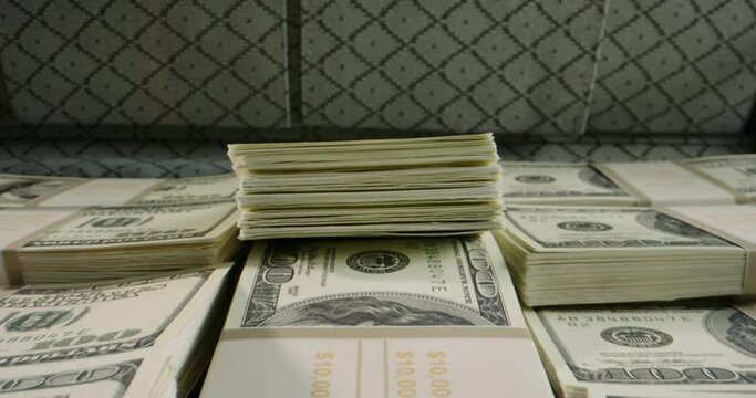 Close up shot of briefcase full of 100 US dollars packs. A suitcase stuffed with cash. Currency, cash flow, business and financing 4k footage