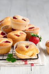 Homemade strawberry muffins or cupcakes. Culinary bakery concept.  Fruit  summer baking. Selective focus