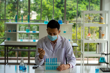 Asian medical  scientist working in clinical laboratory for virus vaccine 