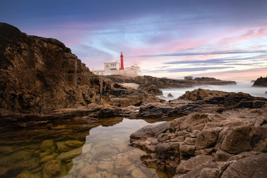 Amazing lighthouse in the Portuguese coastline at the sunset. Cascais Portugal