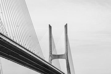 Fototapeta premium Vasco da Gama bridge in Lisbon, Portugal; cable stayed bridge flanked by viaducts and rangeviews that spans the Tagus river in Parque das Nacoes, the second longest bridge in Europe