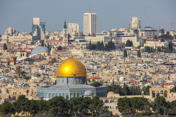 Beautiful dome of the rock, sacred centre of Islam, Jerusalem.  Modern city of Jerusalem in the background