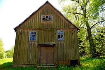 The belfry, turret and general view of the wooden Catholic church of the Exaltation of the Holy Cross in the town of Seroczyn. A new brick church has been operating since 1993, the wooden one is deter