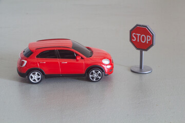 Toy car and stop roadsign - 434613862