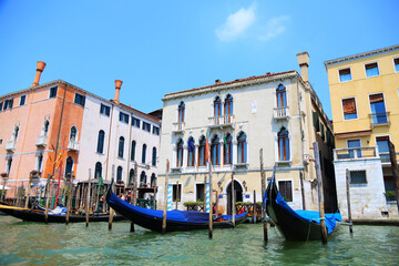 Fototapeta na wymiar Venice on a summer day. Gondolas ready to receive tourists