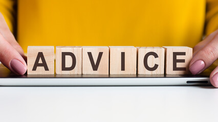 woman made word advice with wooden blocks, concept