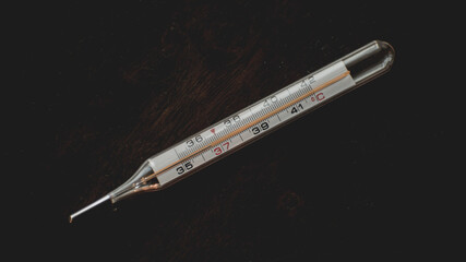 thermometer shows the temperature of a healthy person (36,6)