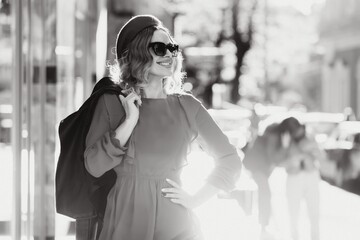 Obraz premium fashion portrait of young beautiful stylish woman walking in city street, style trend, drinking coffee.