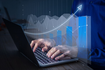 Financial charts showing growing revenue and successful investment strategies. Data analyst working...
