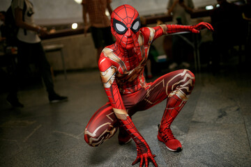 Naklejka premium Kiev, Ukraine - June 1, 2019: Kiev Comic Con, an annual fandom festival in Ukraine. Girl in Miss Marvel costume. Cosplayers dressed as their favorite superheroes. Marvel Cosplay, Avengers, DC