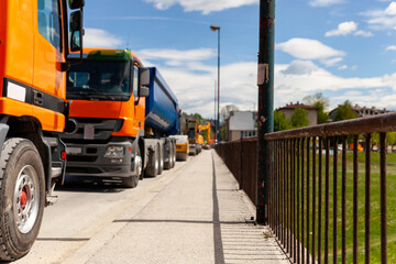 Trucks parked on the street and ready to transport construction materials