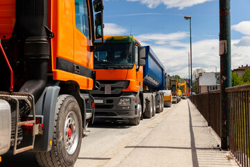 Trucks parked on the street and ready to transport construction materials