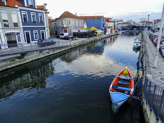Fototapeta na wymiar Aveiro travel destination in Portugal, wonderful small city. Reflection in water.