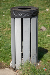 Obraz premium Gray trash can in a parking in Romania