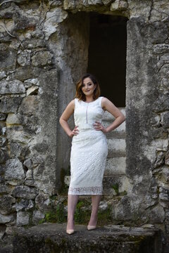 Beautiful young girl posing in the old town