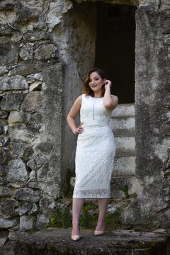 Beautiful young girl posing in the old town