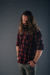 Beautiful strong nordic man with stylish hairstyle and beard on a isolated background.