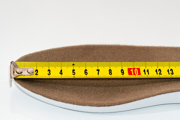 Shoe size measurement. Measure tape measure insoles. shoes size concept. close-up.  measure...