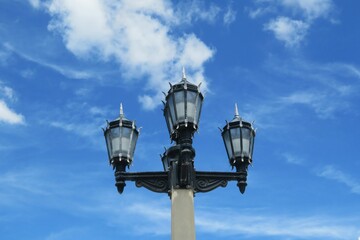 Fototapeta na wymiar Street lamp on blue sky background