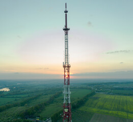 Mobile communication tower during sunset from above.