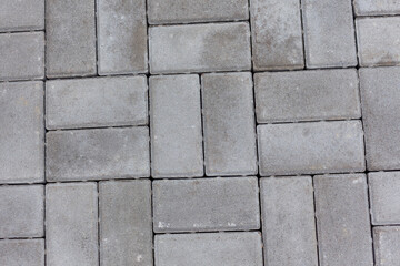 Background of gray stone paving slabs.