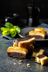 Sliced sponge dessert. Sweet sponge cake with chocolate