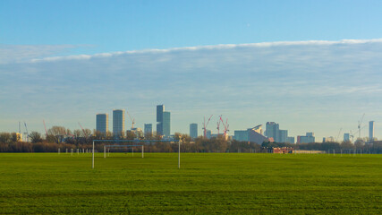 Fototapeta na wymiar View from Hackney Marshes to Canary Wharf, London, UK