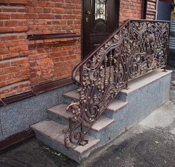 staircase entrance from the street with forged railings